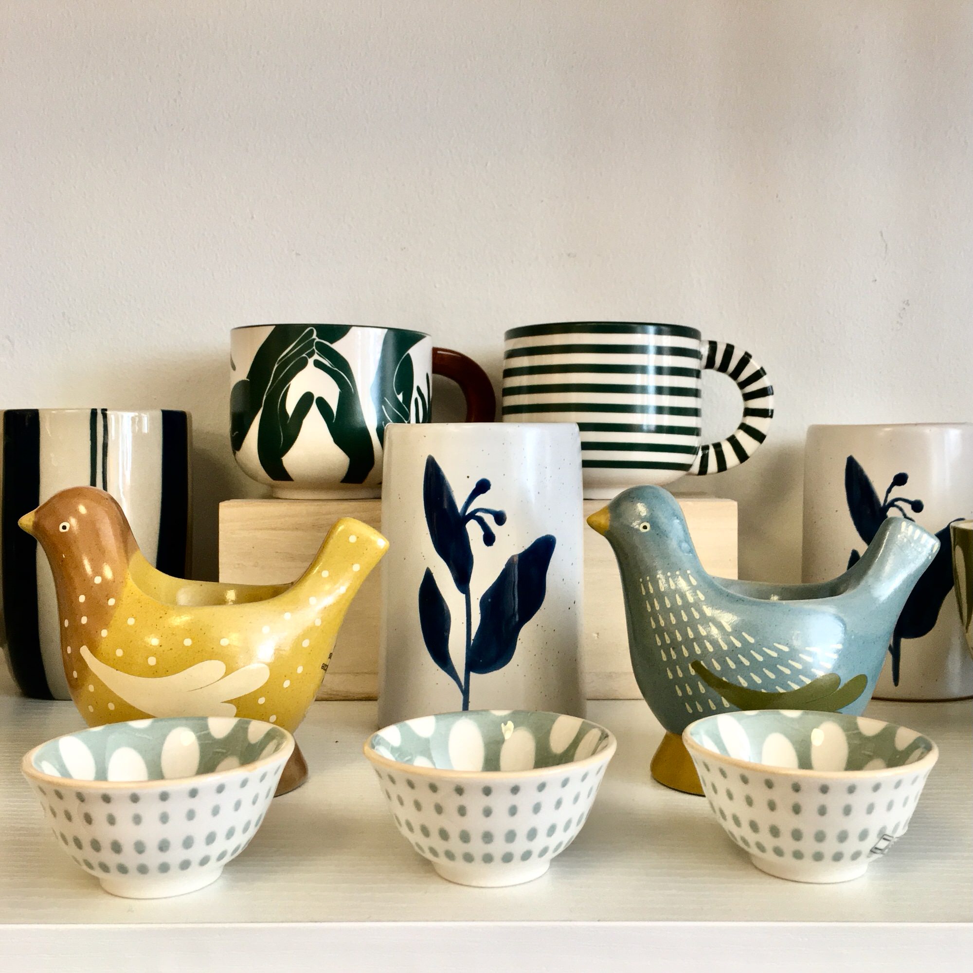 Hand-painted ceramic birds and bowls